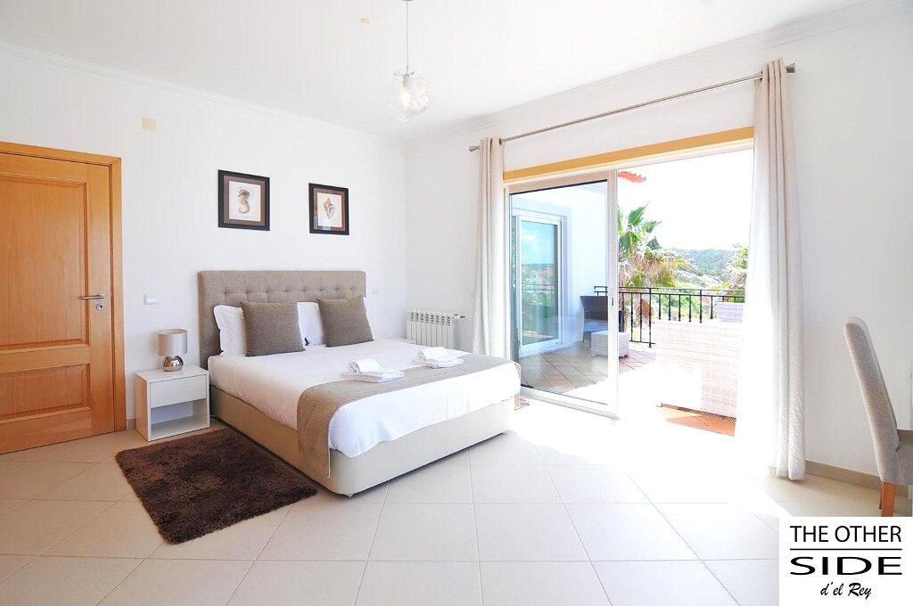 Bedroom 1: double bed and terrace access