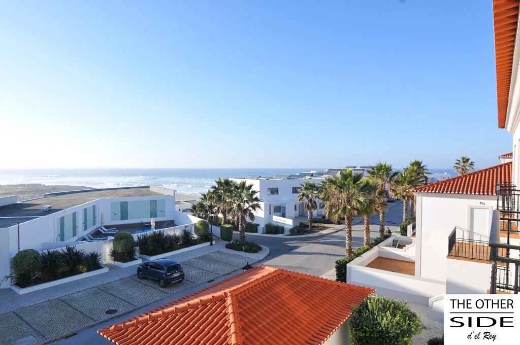 Panoramic view over the Atlantic, the resort villas and palm trees